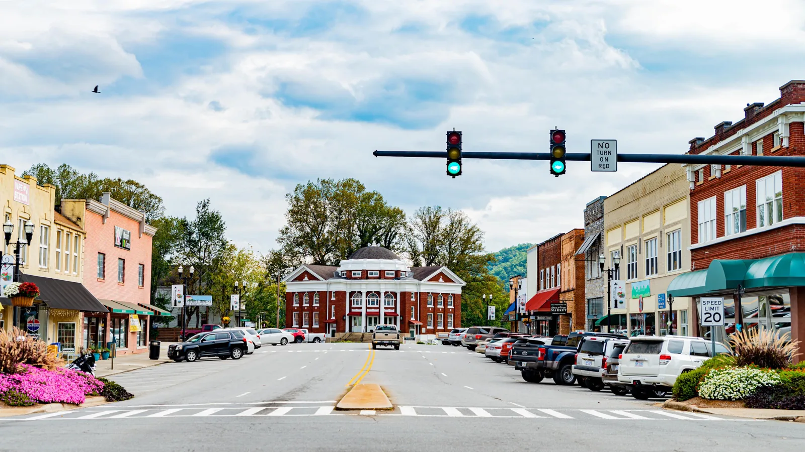 Main street of downtown Murphy with storefronts and a red brick civic building, demolition contractor based in Murphy